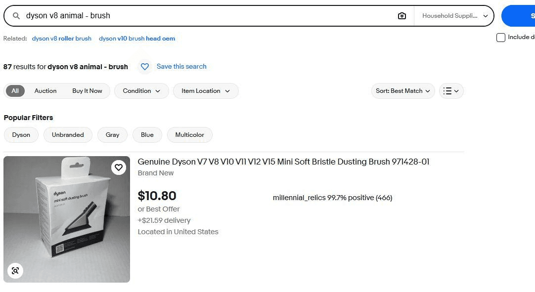 eBay search for dyson v8 animal - brush showing 87 results, with the category switched to Household Supplies and a mini dusting brush first